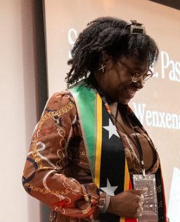 Wenxena Spencer was in charge of the passing of the torch at the Multicultural Student Celebration and Sankofa